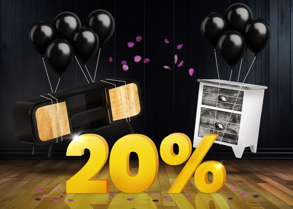 Console TV nera e tavolino bianco con palloncini neri davanti a un cartello giallo brillante del 20% su un pavimento di legno scuro.